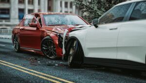 A red car and a white car crashed into each other after a car was loaned to someone and they got into an accident.